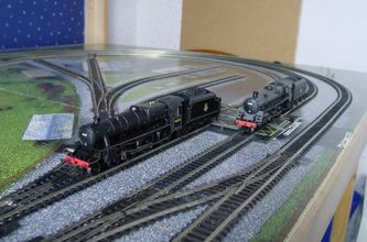 Two generations of design: A Stanier and a Standard Class 5 stand together on the Webmaster's baseboard, 2004. Photo S DESMOND